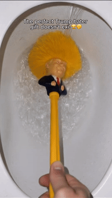 Trump-inspired toilet brush being used to clean a toilet